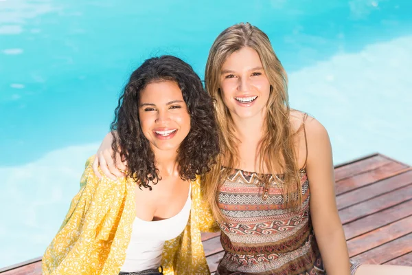 Portrait of young women having fun near pool — Stock Photo, Image