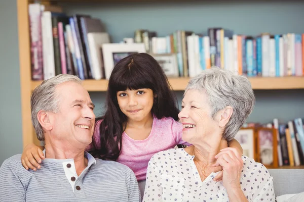 Happy granddaughter with grandparents — Stock Photo, Image