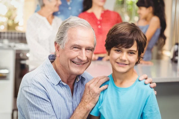 Grandfather and grandson with family — Stock Photo, Image