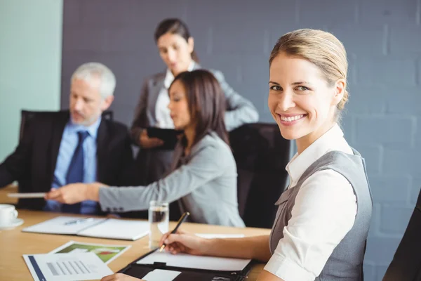 Confident businesswoman in business meeting Stock Picture