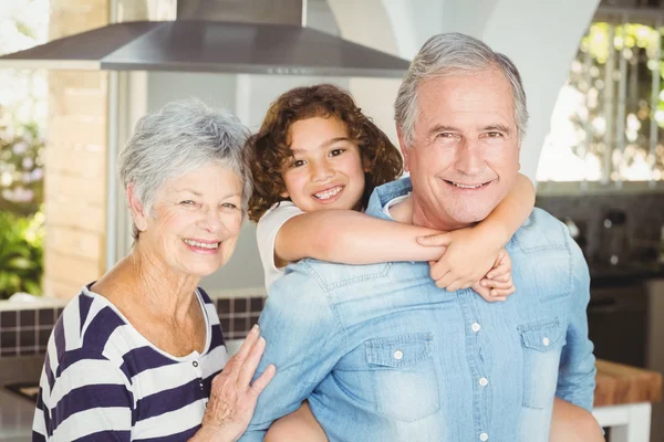 Grandfather carrying boy — Stock Photo, Image