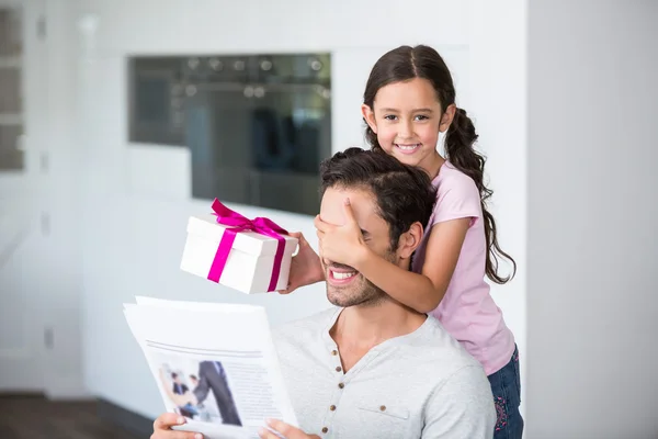 Daughter covering father eyes — Stock Photo, Image