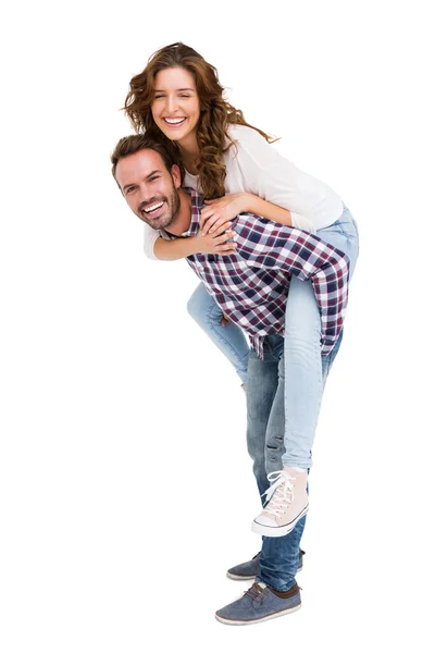 Homem dando piggyback passeio para mulher — Fotografia de Stock