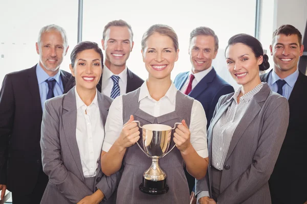 Winning business team with trophy — Stock Photo, Image