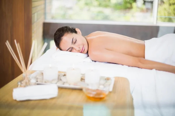 Young woman lying on massage table — Stock Photo, Image