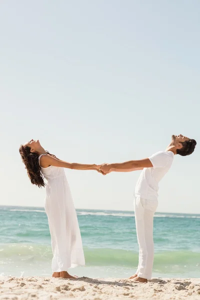 Young couple holding hands — Stock Photo, Image