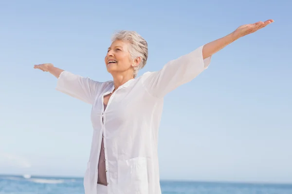 Casual senior woman with arms outstretched — Stock Photo, Image