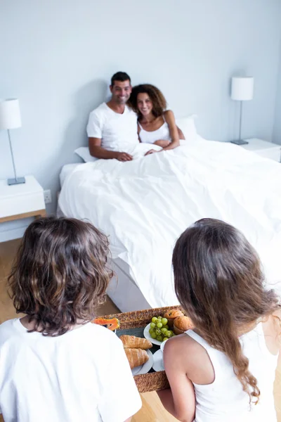 Daughter and son carrying breakfast tray — Stock Photo, Image