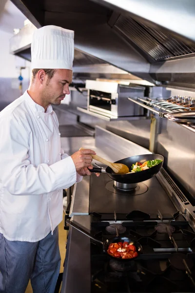 Chef preparing food in the kitchen — Stock Photo, Image