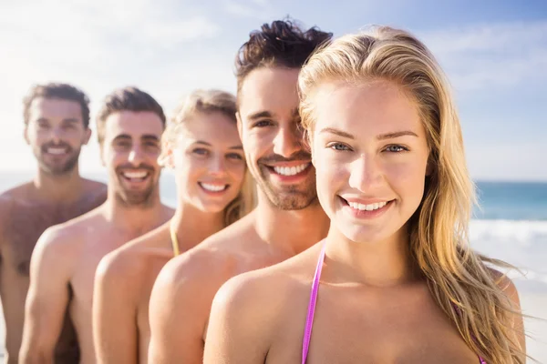 Smiling friends standing in line — Stock Photo, Image
