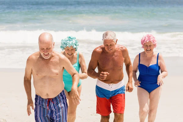 Senior friends getting out of water — Stock Photo, Image