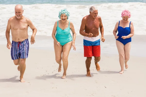Senior friends getting out of water — Stock Photo, Image