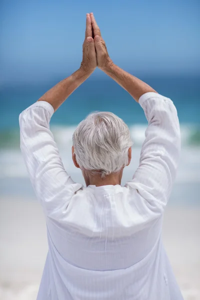 Rear view of mature woman posing with hands joined — Stock Photo, Image