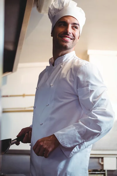 Chef holding his stove — Stock Photo, Image