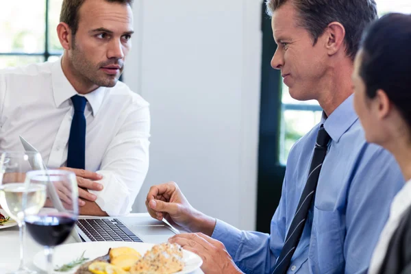 Businessmen discussing during business meeting Stock Image