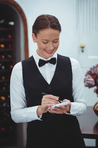 Smiling waitress taking an order Stock Picture