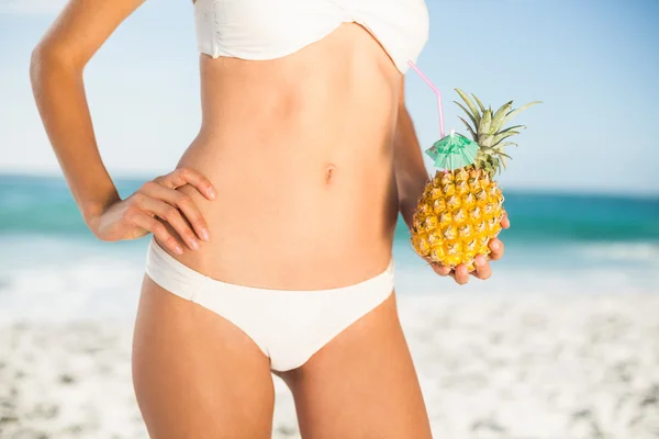 Woman holding a pineapple Stock Image