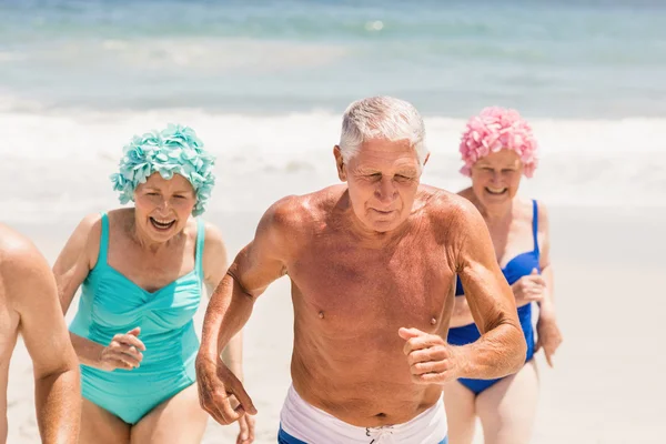 Senior friends running together — Stock Photo, Image