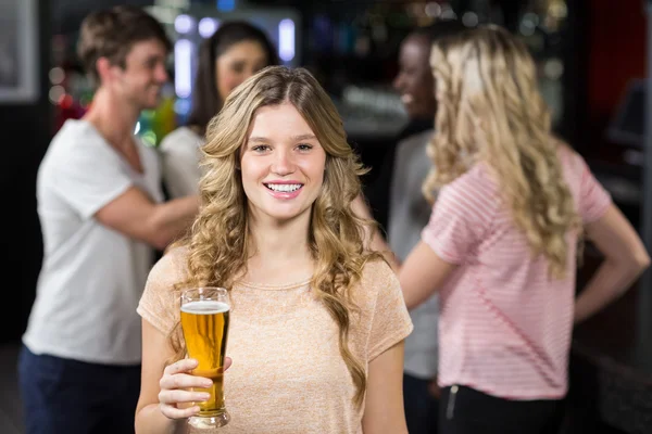 Smiling friends having beers — Stock Photo, Image