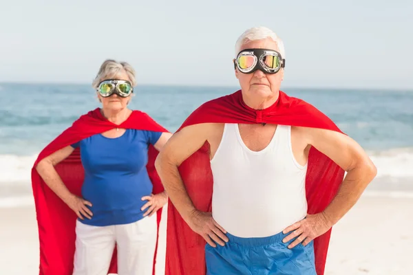 Senior couple wearing superman costume — Stock Photo, Image