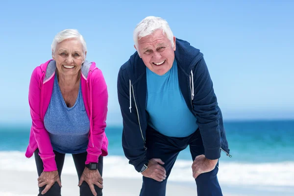 Mature couple tired after running — Stock Photo, Image