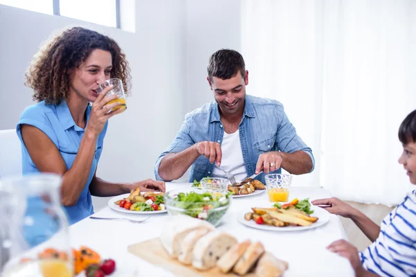 Family sitting at breakfast table — Stock Photo, Image