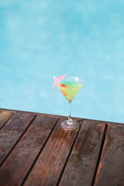 Cocktail glass on wooden deck — Stock Photo, Image