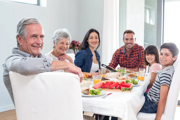 Happy family having breakfast — Stock Photo, Image