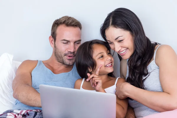 Happy family in their bedroom — Stock Photo, Image