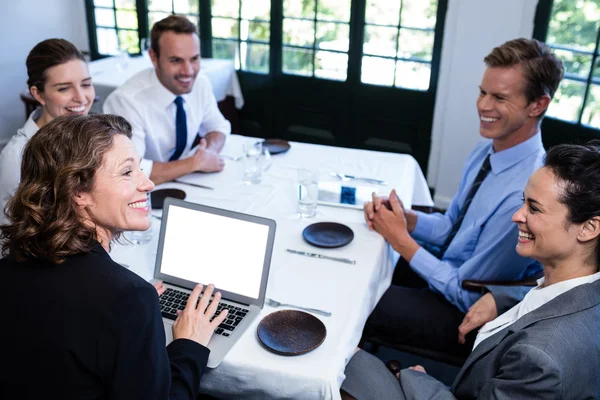 Business colleagues having meeting in restaurant — Stock Photo, Image