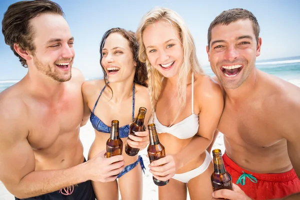 Happy friends enjoying on the beach Stock Picture