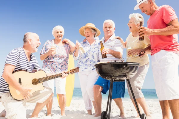 Senior friends having a barbecue — Stock Photo, Image