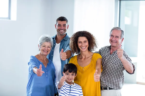 Portrait of happy family showing their thumbs up — Stock Photo, Image