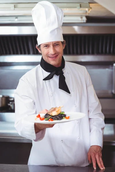 Chef showing plate of spaghetti — Stock Photo, Image