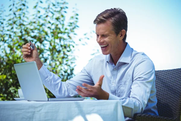 Happy businessman doing online shopping — Stock Photo, Image