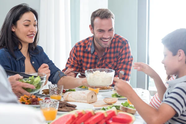 Happy family having breakfast — Stock Photo, Image