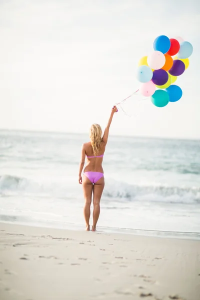 Beautiful woman holding balloon Stock Picture