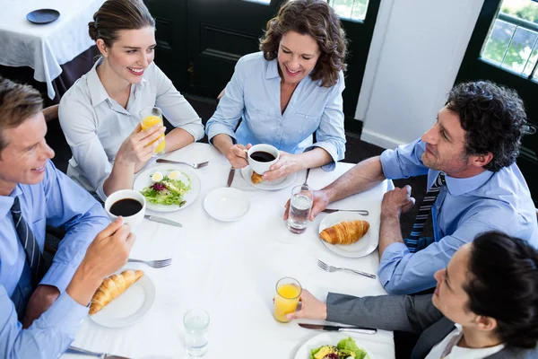 Business people having meeting in restaurant Royalty Free Stock Images
