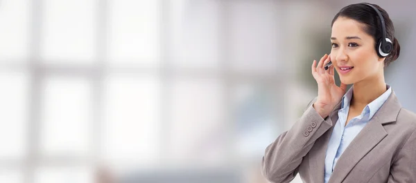 Focused operator posing with headset — Stock Photo, Image