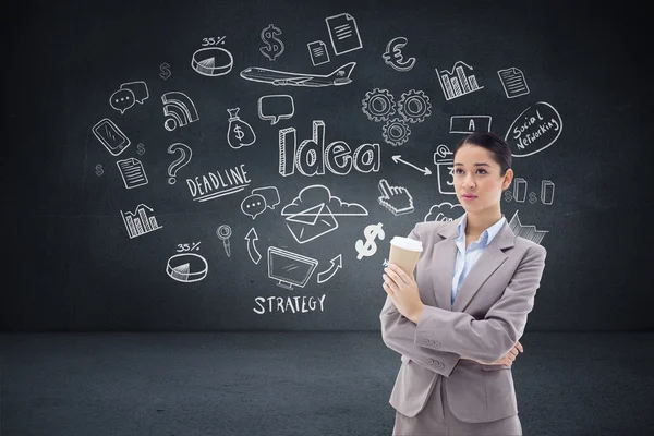 Cute businesswoman holding a takeaway tea — Stock Photo, Image