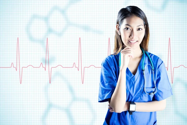 Asian nurse thinking with hand on chin — Stock Photo, Image