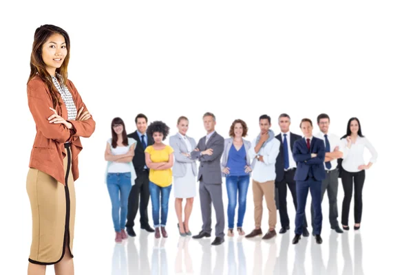 Smiling businesswoman with crossed arms — Stock Photo, Image