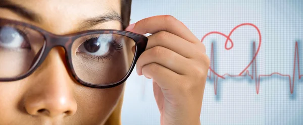 Businesswoman holding her eyeglasses — Stock Photo, Image