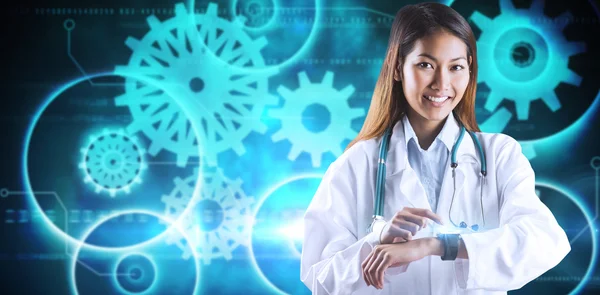 Asian doctor using her smart watch — Stock Photo, Image