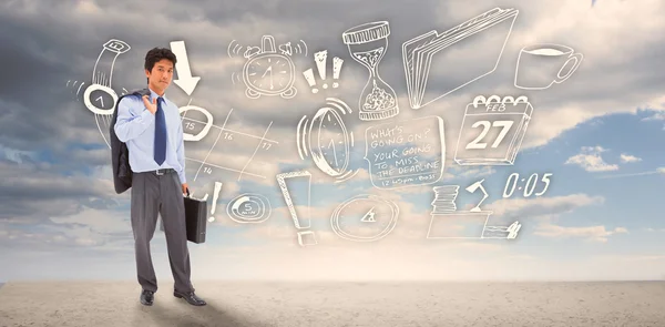 Businessman holding a briefcase and his jacket — Stock Photo, Image