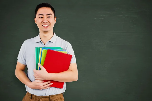 Sonriente hombre sosteniendo archivos — Foto de Stock