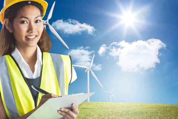 Architect woman with yellow helmet and plans — Stock Photo, Image