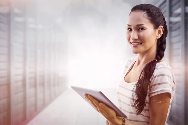 Businesswoman using tablet in office — Stock Photo, Image