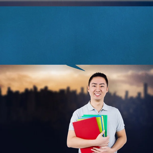 Imagem composta de homem sorridente segurando arquivos — Fotografia de Stock