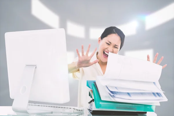Businesswoman shouting with stack of folders — Stock Photo, Image